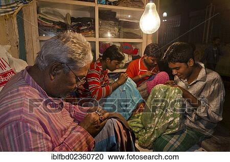"Tailors working at night, Kolkata, India, Asia" View Large Photo Image Stock Image - "Tailors working at night, Kolkata, India, Asia". Fotosearch