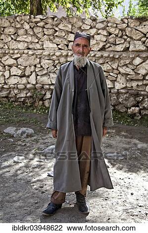 Stock Image - "Tajik man, Pamir Highway, M41, on the border to Afghanistan, Gorno-Badakhshan Autonomous Province, Tajikistan, Asia". Fotosearch