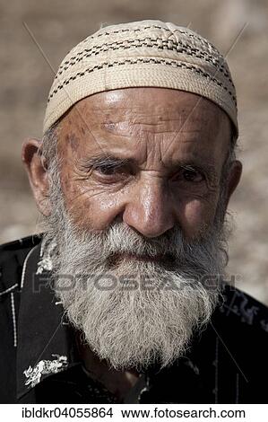 Picture - "Tajik man, portrait, Pamir Highway, M41, on the border to Afghanistan, Gorno-Badakhshan Autonomous Province, Tajikistan, Asia". Fotosearch