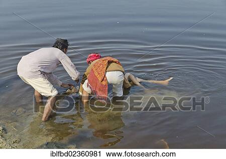 "Taking a dead body to the water of river Yamuna as part of a cremation ceremony, Vrindavan, India, Asia" View Large Photo Image Stock Image - "Taking a dead body to the water of river Yamuna as part of a cremation ceremony, Vrindavan, India, Asia". Fotosearch