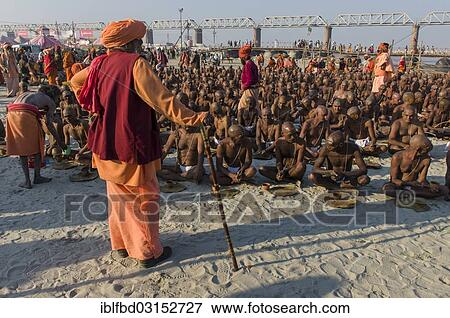 "Taking their first meal in their new lives as part of the initiation of new sadhus at the Sangam, the confluence of the rivers Ganges, Yamuna and Saraswati, during Kumbha Mela festival, Allahabad, Uttar Pradesh, India, Asia" View Large Photo Image Stock Photo - "Taking their first meal in their new lives as part of the initiation of new sadhus at the Sangam, the confluence of the rivers Ganges, Yamuna and Saraswati, during Kumbha Mela festival, Allahabad, Uttar Pradesh, India, Asia". Fotosearch