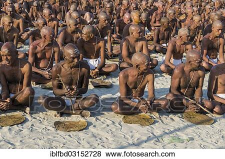 "Taking their first meal in their new lives as part of the initiation of new sadhus, during Kumbha Mela festival, Allahabad, Uttar Pradesh, India, Asia" View Large Photo Image Stock Photo - "Taking their first meal in their new lives as part of the initiation of new sadhus, during Kumbha Mela festival, Allahabad, Uttar Pradesh, India, Asia". Fotosearch
