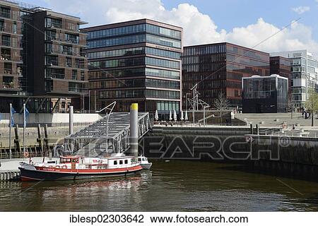 Stock Image - "Tall Ship Harbour, Traditionsschiffhafen harbour, modern residential and office buildings, Elbe Philharmonic Hall pavilion, Magellan Terraces, Sandtorhafen harbour, Sandtorkai street, HafenCity, Hamburg, Hamburg, Germany, Europe". Fotosearch