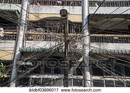 Stock Photo - "Tangled cables, power lines, Yangon or Rangoon, Yangon Region, Myanmar, Asia". Fotosearch
