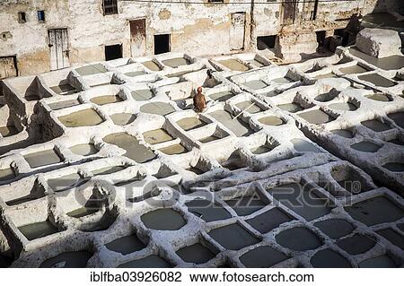 Stock Image - "Tanneries where animal hides are traditionally tanned by hand, Fes, Morocco, Africa". Fotosearch