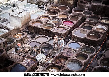 Stock Photography - "Tanneries where animal hides are traditionally tanned by hand, Fes, Morocco, Africa". Fotosearch