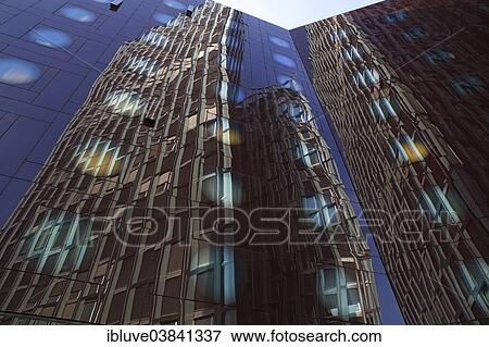 "Tanzende Turme office building reflected in the facade of the Arcotel Onyx Hotel, Reeperbahn, St. Pauli, Hamburg, Hamburg, Germany, Europe" View Large Photo Image Stock Photo - "Tanzende Turme office building reflected in the facade of the Arcotel Onyx Hotel, Reeperbahn, St. Pauli, Hamburg, Hamburg, Germany, Europe". Fotosearch