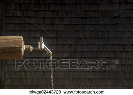Stock Image - "Tap without a handle, fountain or well, Gerstruben near Oberstdorf, Allgaeu, Bavaria, Germany, Europe, PublicGround, Europe". Fotosearch