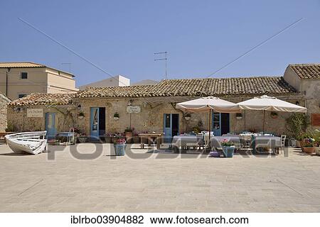 Stock Image - "Tavern in Piazza Regina Margherita, Marzamemi, Province of Syracuse, Sicily, Italy, Europe". Fotosearch