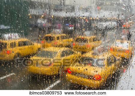 "Taxis in the rain, Manhattan, New York City, New York, USA" View Large Photo Image Stock Image - "Taxis in the rain, Manhattan, New York City, New York, USA". Fotosearch