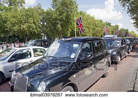 "Taxis waiting for the end of the Changing of the Guard ceremony in The Mall, City of Westminster, London, England, United Kingdom, Europe" View Large Photo Image Stock Photo - "Taxis waiting for the end of the Changing of the Guard ceremony in The Mall, City of Westminster, London, England, United Kingdom, Europe". Fotosearch
