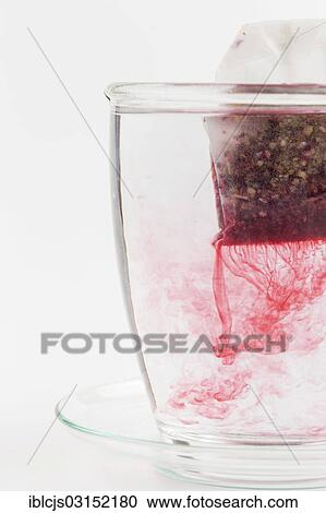 "Tea bag in a cup, giving off flavourings and colourings, Lindlar, Bergisches Land, North Rhine-Westphalia, Germany, Europe" View Large Photo Image Stock Image - "Tea bag in a cup, giving off flavourings and colourings, Lindlar, Bergisches Land, North Rhine-Westphalia, Germany, Europe". Fotosearch