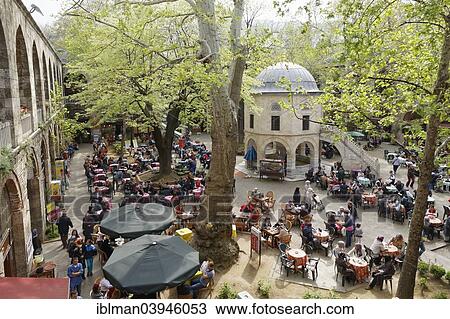 Stock Image - "Tea garden in the courtyard of the Silk Bazaar or Koza Han, bazaar district, Bursa, Marmara Region, Turkey, Asia". Fotosearch