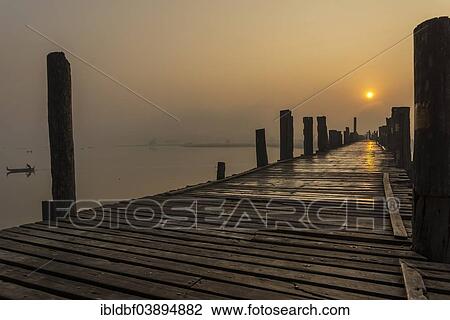 "Teak bridge at sunrise, U Bein bridge across Thaungthaman Lake, Amarapura, Mandalay Division, Myanmar, Asia" View Large Photo Image Stock Image - "Teak bridge at sunrise, U Bein bridge across Thaungthaman Lake, Amarapura, Mandalay Division, Myanmar, Asia". Fotosearch