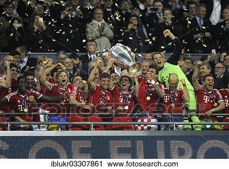 "Team of FC Bayern cheering jubilantly with the trophy, UEFA Champions League Final 2013, Borussia Dortmund - FC Bayern Munich, Wembley-Stadium, London, London region, England, United Kingdom, Europe" View Large Photo Image Stock Image - "Team of FC Bayern cheering jubilantly with the trophy, UEFA Champions League Final 2013, Borussia Dortmund - FC Bayern Munich, Wembley-Stadium, London, London region, England, United Kingdom, Europe". Fotosearch