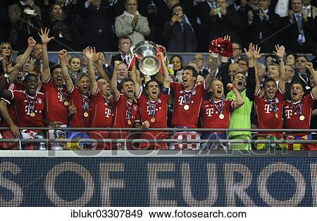 "Team of FC Bayern cheering jubilantly with the trophy, UEFA Champions League Final 2013, Borussia Dortmund - FC Bayern Munich, Wembley-Stadium, London, London region, England, United Kingdom, Europe" View Large Photo Image Stock Photo - "Team of FC Bayern cheering jubilantly with the trophy, UEFA Champions League Final 2013, Borussia Dortmund - FC Bayern Munich, Wembley-Stadium, London, London region, England, United Kingdom, Europe". Fotosearch