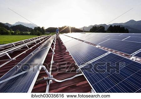 "Technician inspecting a solar energy plant, Schwendt, Kitzbuhel District, North Tyrol, Tyrol, Austria, Europe" View Large Photo Image Stock Photograph - "Technician inspecting a solar energy plant, Schwendt, Kitzbuhel District, North Tyrol, Tyrol, Austria, Europe". Fotosearch