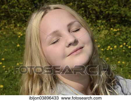 "Teenage girl, 15 years, enjoying the sunshine, Sweden, Europe" View Large Photo Image Stock Image - "Teenage girl, 15 years, enjoying the sunshine, Sweden, Europe". Fotosearch