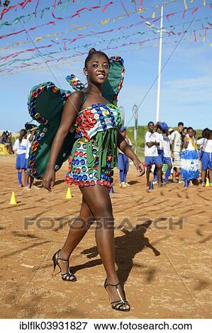 "Teenage girl presenting a butterfly costume made of recycled materials such as lids of plastic bottles at a fashion show of a social project, Salvador da Bahia, Bahia, Brazil, South America" View Large Photo Image Stock Photo - "Teenage girl presenting a butterfly costume made of recycled materials such as lids of plastic bottles at a fashion show of a social project, Salvador da Bahia, Bahia, Brazil, South America". Fotosearch