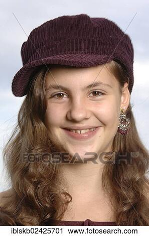 "Teenage girl wearing a baseball cap, portrait" View Large Photo Image Stock Image - "Teenage girl wearing a baseball cap, portrait". Fotosearch