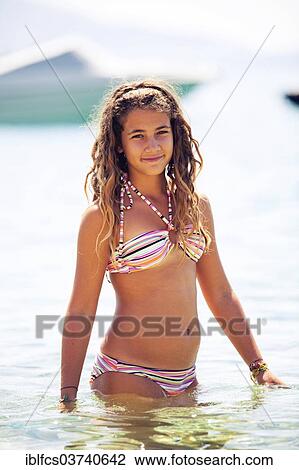 "Teenage girl wearing a bikini, standing in the water, Martinscica, Cres island, Primorje-Gorski Kotar County, Croatia, Europe" View Large Photo Image Stock Image - "Teenage girl wearing a bikini, standing in the water, Martinscica, Cres island, Primorje-Gorski Kotar County, Croatia, Europe". Fotosearch