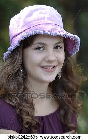 Stock Photography - "Teenage girl wearing a hat, portrait". Fotosearch