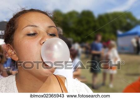 "Teenager, 14 years, blowing bubbles with a chewing gum, Hesse, Germany, Europe" View Large Photo Image Stock Image - "Teenager, 14 years, blowing bubbles with a chewing gum, Hesse, Germany, Europe". Fotosearch