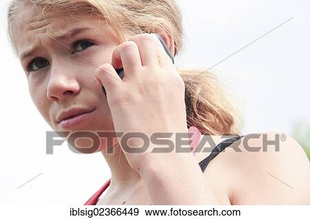 Stock Photo - Teenager with a mobile phone. Fotosearch