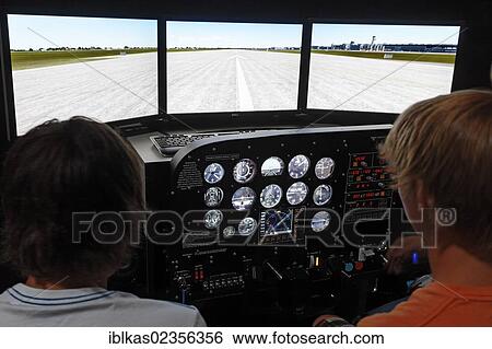 Stock Photograph - "Teenagers as pilots in a Prop Cockpit Trainer, flight simulator, IdeenPark 2012, technology and education summit conference for young people, Essen, Ruhr area, North Rhine-Westphalia, Germany, Europe". Fotosearch