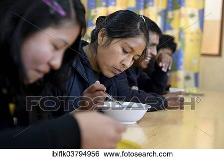 "Teenagers eating in the cafeteria of their school, El Alto, Department of La Paz, Bolivia, South America" View Large Photo Image Stock Photograph - "Teenagers eating in the cafeteria of their school, El Alto, Department of La Paz, Bolivia, South America". Fotosearch