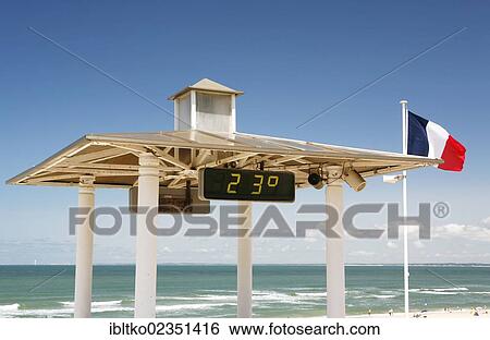 "Temperature display and a French national flag, beach, Atlantic coast at Soulac-sur-Mer, Aquitaine, Departement Gironde, France, Europe" View Large Photo Image Stock Photograph - "Temperature display and a French national flag, beach, Atlantic coast at Soulac-sur-Mer, Aquitaine, Departement Gironde, France, Europe". Fotosearch