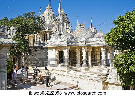 "Temple complex on the holy mountain of Shatrunjaya, important pilgrimage site for followers of Jainism, one of the four most sacred mountains of Jainism, a pilgrim is carried with the help of a long bamboo pole, Palitana, Gujarat, India, Asia" View Large Photo Image Stock Photo - "Temple complex on the holy mountain of Shatrunjaya, important pilgrimage site for followers of Jainism, one of the four most sacred mountains of Jainism, a pilgrim is carried with the help of a long bamboo pole, Palitana, Gujarat, India, Asia". Fotosearch