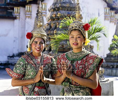 "Temple dancers at Wat Pho, displaying the Wai, a Thai gesture of greeting, two young women wearing traditional dance costumes, Bangkok, Thailand, Asia" View Large Photo Image Stock Image - "Temple dancers at Wat Pho, displaying the Wai, a Thai gesture of greeting, two young women wearing traditional dance costumes, Bangkok, Thailand, Asia". Fotosearch