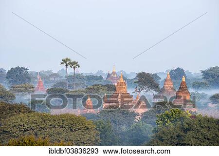 "Temples in the morning mist, stupas and pagodas in the temple complex of the Plateau of Bagan, Mandalay Division, Myanmar or Burma" View Large Photo Image Stock Image - "Temples in the morning mist, stupas and pagodas in the temple complex of the Plateau of Bagan, Mandalay Division, Myanmar or Burma". Fotosearch