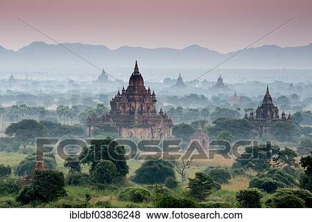 "Temples in the morning mist, stupas and pagodas in the temple complex of the Plateau of Bagan, Mandalay Division, Myanmar or Burma" View Large Photo Image Stock Photo - "Temples in the morning mist, stupas and pagodas in the temple complex of the Plateau of Bagan, Mandalay Division, Myanmar or Burma". Fotosearch