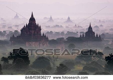 "Temples in the morning mist, stupas and pagodas in the temple complex of the Plateau of Bagan, Mandalay Division, Myanmar or Burma" View Large Photo Image Stock Photo - "Temples in the morning mist, stupas and pagodas in the temple complex of the Plateau of Bagan, Mandalay Division, Myanmar or Burma". Fotosearch