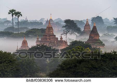 "Temples in the morning mist, stupas and pagodas in the temple complex of the Plateau of Bagan, Mandalay Division, Myanmar or Burma" View Large Photo Image Stock Photograph - "Temples in the morning mist, stupas and pagodas in the temple complex of the Plateau of Bagan, Mandalay Division, Myanmar or Burma". Fotosearch