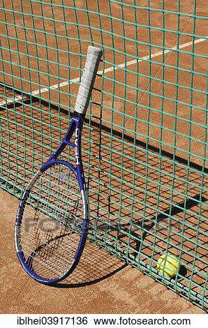 Tennis racket next to net View Large Photo Image Stock Photograph - Tennis racket next to net. Fotosearch