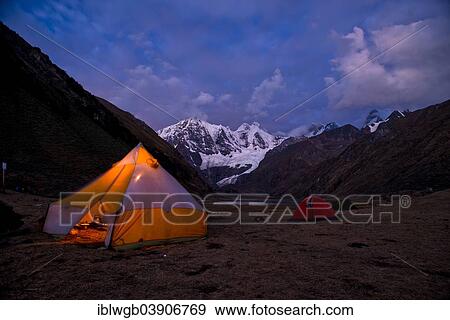 "Tent camp at lake Laguna Jahuacocha at dusk, snow-capped mountains of the Cordillera Huayhuash mountain range at the back, Northern Peru, Peru, South America" View Large Photo Image Stock Photo - "Tent camp at lake Laguna Jahuacocha at dusk, snow-capped mountains of the Cordillera Huayhuash mountain range at the back, Northern Peru, Peru, South America". Fotosearch