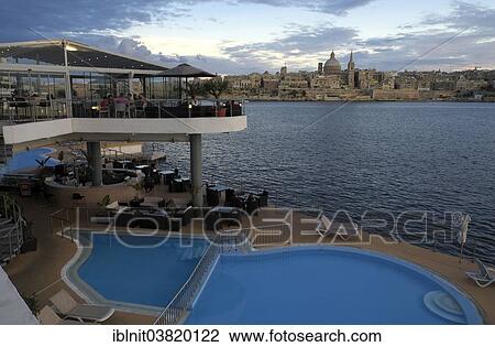 "Terrace and pool of Fortina Hotel, looking towards Valletta with the Carmelite Church, Valletta, Malta, Europe" View Large Photo Image Stock Image - "Terrace and pool of Fortina Hotel, looking towards Valletta with the Carmelite Church, Valletta, Malta, Europe". Fotosearch