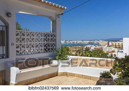 Stock Photo - "Terrace, fishing village of Ferragudo, Algarve, Portugal, Europe". Fotosearch