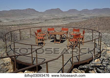 Stock Photograph - "Terrace of Etambura Camp, a lodge run by Himba, near Orupembe, Kaokoland, Kunene, Namibia, Africa". Fotosearch