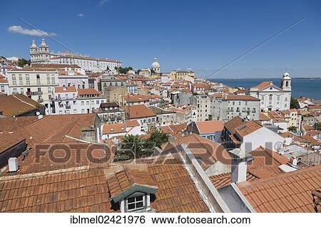 Terrace Portas do Sol, Gates to the Sun, Largo das Portas do Sol, overlooking the Alfama rooftops with The Church, Monastery of Sao Vicente de Fora, Mosteiro, Igreja de Sao Vicente de Fora and river Tagus, Lisboa, Lisbon, Portugal, Europe View Large Photo Image Stock Photograph - Terrace Portas do Sol, Gates to the Sun, Largo das Portas do Sol, overlooking the Alfama rooftops with The Church, Monastery of Sao Vicente de Fora, Mosteiro, Igreja de Sao Vicente de Fora and river Tagus, Lisboa, Lisbon, Portugal, Europe. Fotosearch