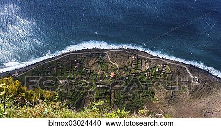 Stock Image - "Terraces at the cliffs of Santa Maria Madalena at the foot of Mount Cabo Girao at Achadas da Cruz, Porto Moinz, Santa Maria Madalena, Madeira, Portugal, Europe". Fotosearch