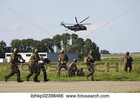 "Terrorists are being arrested, a demonstration of Germany's KSK Special Forces with an SOF helicopter, Laupheim, Baden-Wuerttemberg, Germany, Europe" View Large Photo Image Stock Photograph - "Terrorists are being arrested, a demonstration of Germany's KSK Special Forces with an SOF helicopter, Laupheim, Baden-Wuerttemberg, Germany, Europe". Fotosearch