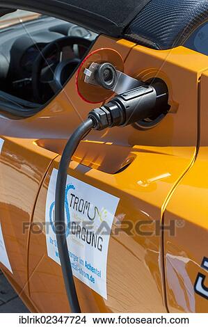 "Tesla Roadster, an American electric sports car having its batteries charged before the prologue of the e-miglia 2012 from Munich to St. Moritz, Munich, Bavaria, Germany, Europe" View Large Photo Image Picture - "Tesla Roadster, an American electric sports car having its batteries charged before the prologue of the e-miglia 2012 from Munich to St. Moritz, Munich, Bavaria, Germany, Europe". Fotosearch
