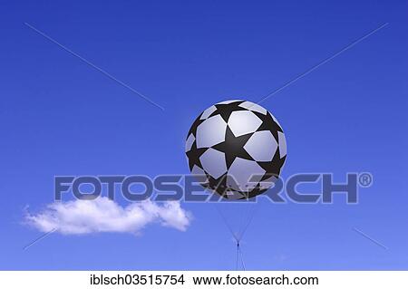 Tethered balloon with the Champions League logo against a blue sky with a cloud View Large Photo Image Picture - Tethered balloon with the Champions League logo against a blue sky with a cloud. Fotosearch