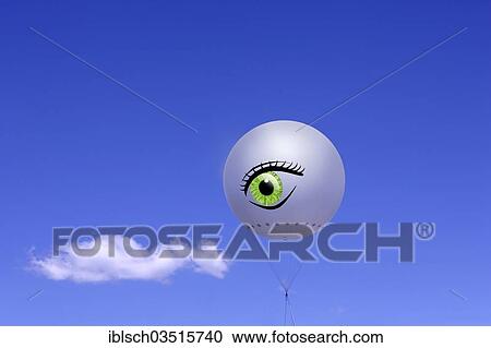 "Tethered balloon with the illustration of a human eye against a blue sky with a cloud, Bavaria, Germany, Europe" View Large Photo Image Stock Image - "Tethered balloon with the illustration of a human eye against a blue sky with a cloud, Bavaria, Germany, Europe". Fotosearch