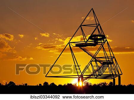 "Tetraeder, a tetrahedron as an artwork on the Beckstrasse slag heap, at sunset, Batenbrock, Bottrop, Ruhr district, North Rhine-Westphalia, Germany, Europe" View Large Photo Image Stock Image - "Tetraeder, a tetrahedron as an artwork on the Beckstrasse slag heap, at sunset, Batenbrock, Bottrop, Ruhr district, North Rhine-Westphalia, Germany, Europe". Fotosearch