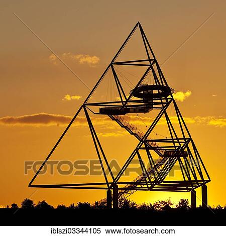 "Tetraeder, a tetrahedron as an artwork on the Beckstrasse slag heap, at sunset, Batenbrock, Bottrop, Ruhr district, North Rhine-Westphalia, Germany, Europe" View Large Photo Image Stock Photography - "Tetraeder, a tetrahedron as an artwork on the Beckstrasse slag heap, at sunset, Batenbrock, Bottrop, Ruhr district, North Rhine-Westphalia, Germany, Europe". Fotosearch